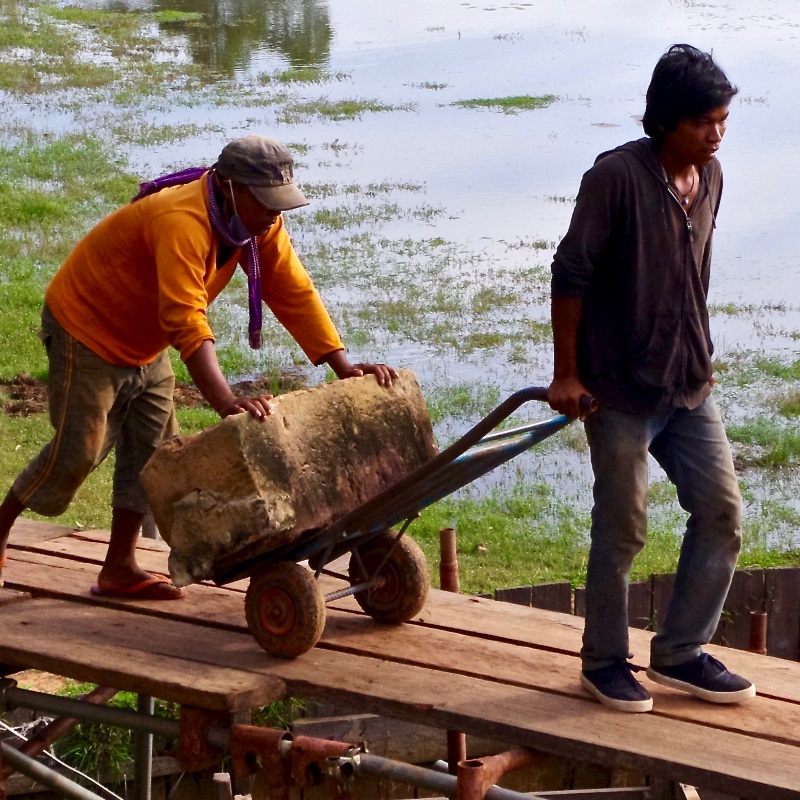 Men carrying stone